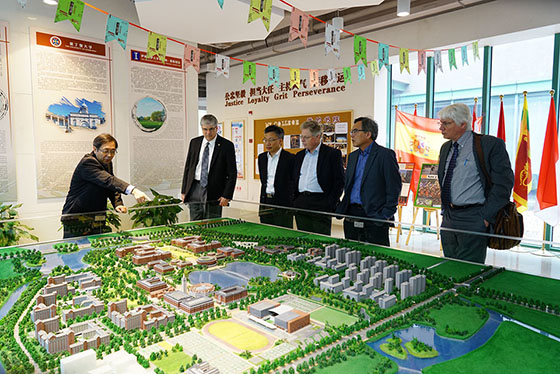 UIUC visiting faculty viewing three dimensional model of Zhejiang International Campus.